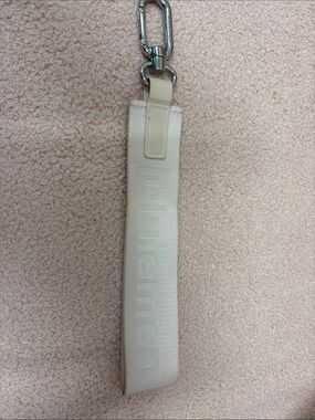 Lululemon Light Pink Wrist Strap Keychain